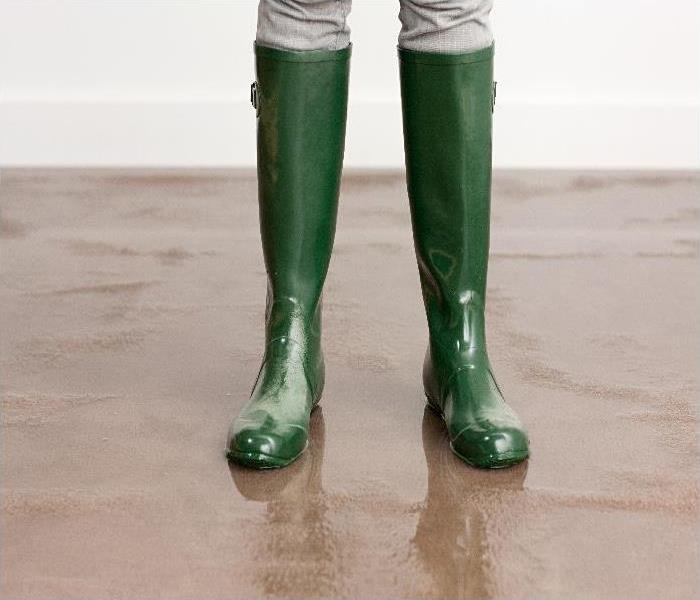 flooded property - image of boots on floor