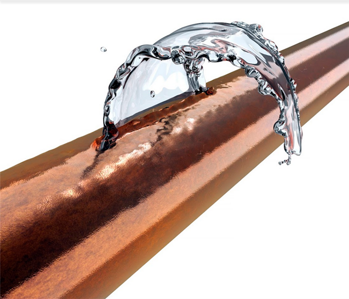 a broken copper pipe that is leaking water
